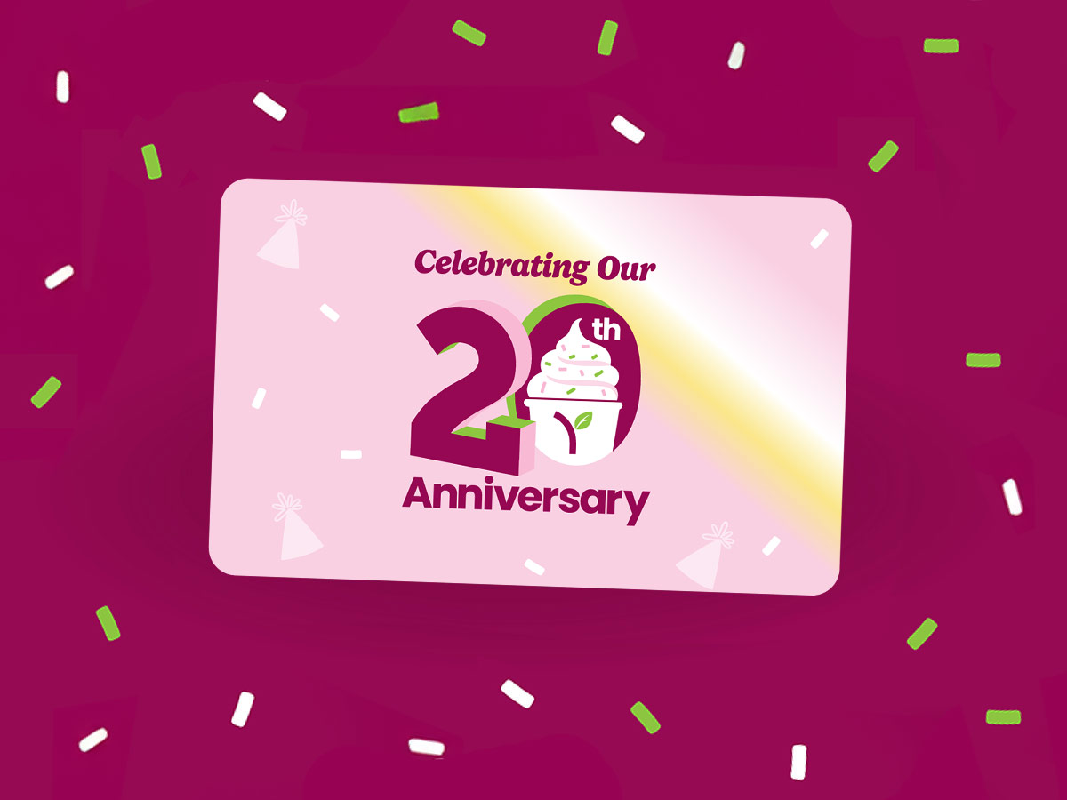 A group of Yogurtland cups of frozen yogurt and toppings