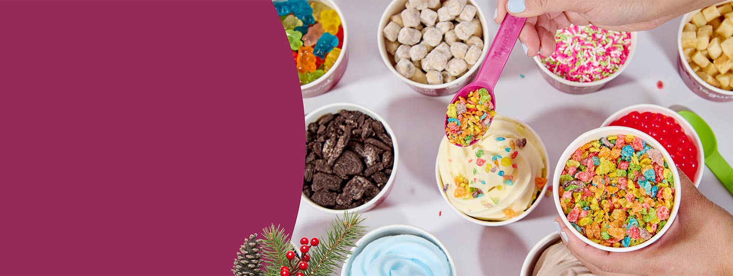 An assortment of Yogurtland frozen yogurt cups and toppings