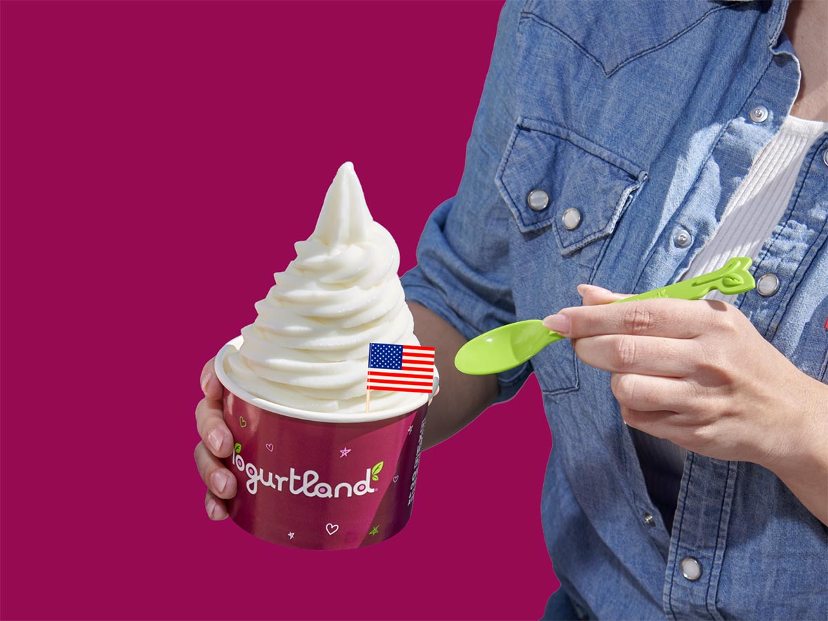 A cup of Yogurtland frozen yogurt with an American flag